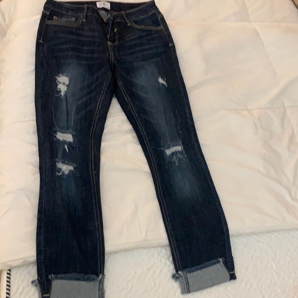 Distressed ankle length skinny leg jeans
